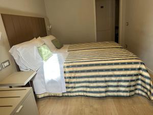 Postel nebo postele na pokoji v ubytování Hotel Giappone