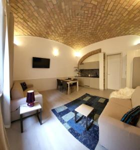 a living room with a couch and a table at Monteoppio one in Rome