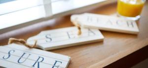 two computer keyboards on a desk with a glass of orange juice at Beach Approach Cottage - 30 steps from beach - Luxury house with covered table tennis - Netflix Smart TV in Filey