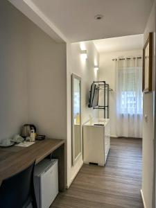 Kuchyň nebo kuchyňský kout v ubytování Dante 134 Rooms