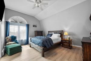 a bedroom with a bed and a ceiling fan at Velocity Residence in Worcester