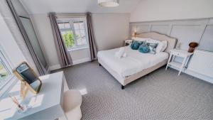 Postel nebo postele na pokoji v ubytování York Cottage House & Spa + 24 fotografií