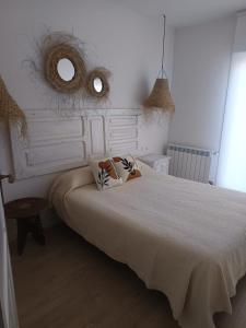 Postel nebo postele na pokoji v ubytování Apartamentos La Muralla