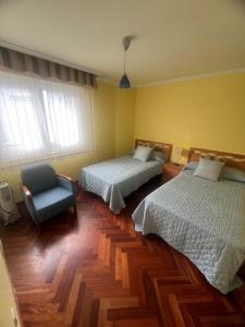 Ένα ή περισσότερα κρεβάτια σε δωμάτιο στο Casa Portonovo