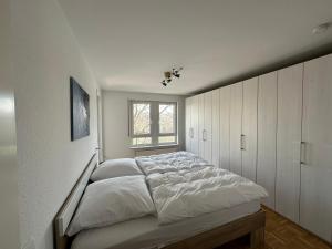 Ένα ή περισσότερα κρεβάτια σε δωμάτιο στο Wohnung am Neckar mit Tiefgarage