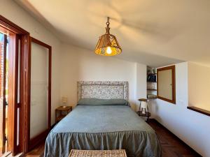 Ένα ή περισσότερα κρεβάτια σε δωμάτιο στο Mazzaforno Graziosa Villetta Relax