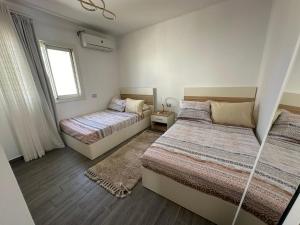 Ένα ή περισσότερα κρεβάτια σε δωμάτιο στο Shaheenz Hospitality