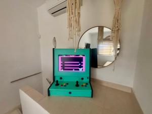 a blue machine sitting on a counter in front of a mirror at Amaya Villa Karyani in Karianí +21 photos