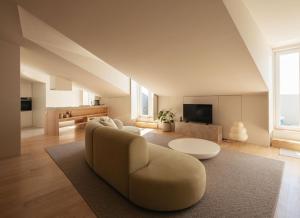 a living room with a couch and a table at LIOZ Hotel & Apartments in Lisbon