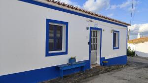 a blue and white house with a blue door at Blue&YellowHouse in Alcoutim