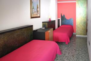 Postel nebo postele na pokoji v ubytování Hotel Pietra Verde