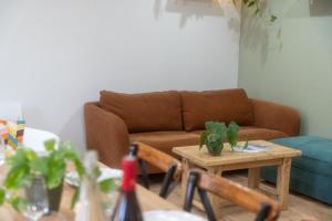 a living room with a couch and a table at Iluka in Ault