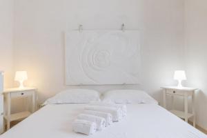 A bed or beds in a room at Villa Verdena - Carovigno