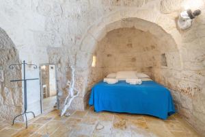 A bed or beds in a room at Villa Verdena - Carovigno