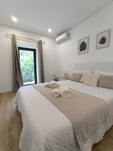 Ένα ή περισσότερα κρεβάτια σε δωμάτιο στο Teixeira Home - Gerês