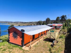 an overhead view of a building with a painting on it at Titicaca Perka Lodge in Puno