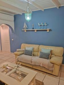 a living room with a couch and a table at Lodges Tenerife in La Mareta +54 photos