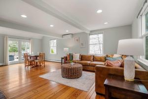 a living room with a couch and a table at 2 Miles to Coast Guard Beach in Eastham
