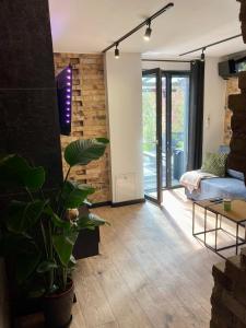 a living room with a couch and a table at Apartament nad Nysą in Łęknica