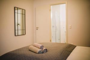 Postel nebo postele na pokoji v ubytování HUGOS Studio Apartment