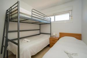 a bedroom with two bunk beds and a window at Estrella 243A in L’Alfàs del Pi +14 photos