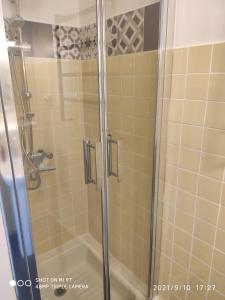 a shower with a glass door in a bathroom at Du Guesclin Appart in Saint-Brieuc
