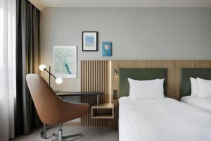 Letto o letti in una camera di Courtyard by Marriott Zurich North