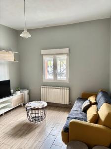 a living room with a couch and a table at Apartamento Colón VUT-47-132 in Valladolid