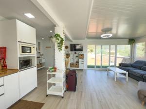a kitchen and living room with a blue couch at Villa Tarifa in Torrox