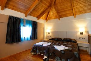 Postel nebo postele na pokoji v ubytování Theros Hotel + 11 fotografií