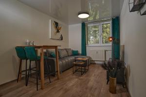 a living room with a couch and a table at ArtSuite in Košice
