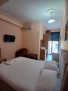 Postel nebo postele na pokoji v ubytování Hotel Rossi