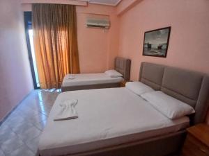 Postel nebo postele na pokoji v ubytování Hotel Rossi