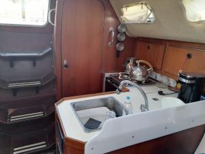 a kitchen with a sink and a counter top at 2-cottage yacht with 2 showers in Datca +13 photos