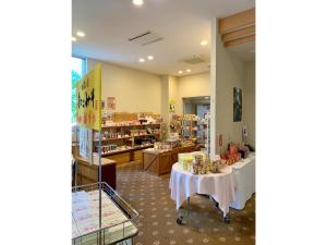 a store with two tables in the middle of a room at Natural Farm City Noen Hotel - Vacation STAY 78838v in Chichibu