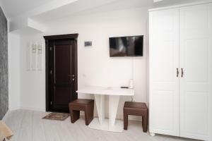 Телевізор і / або розважальний центр в Grey Boutique Hotel Palas