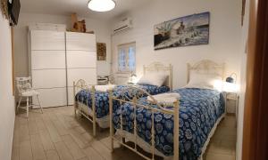 Postel nebo postele na pokoji v ubytování B&B U Mare Mio