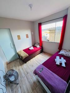 Ένα ή περισσότερα κρεβάτια σε δωμάτιο στο Edícula Privativa e Confortável de Fácil Acesso - Retiro VR RJ