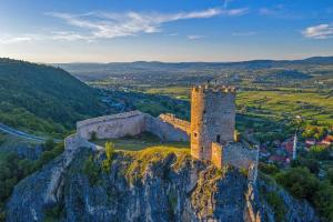 a castle on top of a cliff on a mountain at Apartman STARI GRAD in Bihać