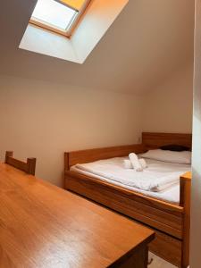 Postel nebo postele na pokoji v ubytování Hotel & wellness Hejtmanka