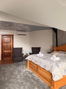 Postel nebo postele na pokoji v ubytování Hotel & wellness Hejtmanka