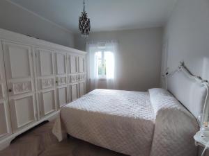 Postel nebo postele na pokoji v ubytování Magnolia Apartment