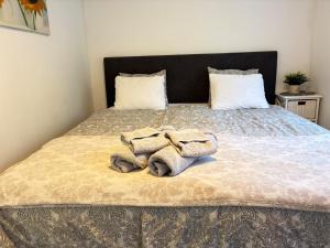 a bedroom with a bed with towels on it at Garden View vacation home in Granna in Gränna