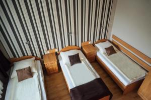 Postel nebo postele na pokoji v ubytování Hotel U Grubego