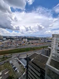 an aerial view of a parking lot in a city at Studio premium próximo a Alphaville in Barueri