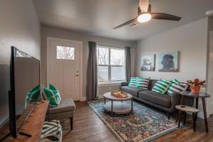 a living room with a couch and a table at Plaza Pad II-Near Plaza District in Oklahoma City