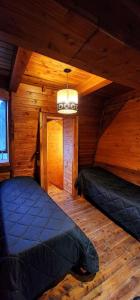 Postel nebo postele na pokoji v ubytování Cabañas Lucero del Bosque