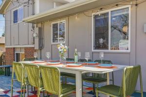 a white table and chairs on a patio at Spacious 4BD - Backyard BBQ, Fire Pit & Mini Golf in Arvada