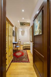 a hallway with a door to a room with a bedroom at Sancta Scala in Rome
