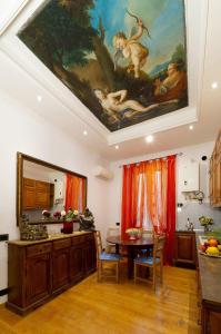 a kitchen with a painting on the ceiling at Sancta Scala in Rome